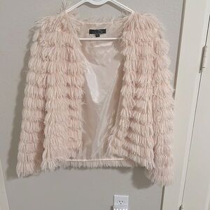 pink fluffy pull over from blue brush